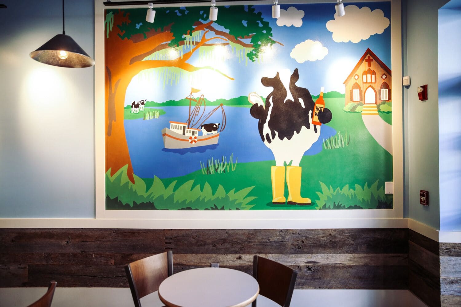 Large mural of a cow outside