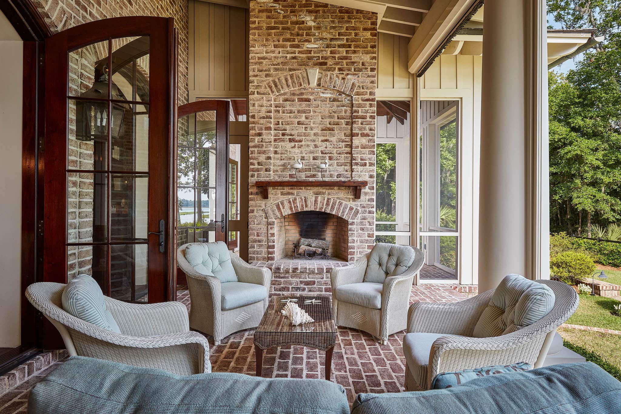 Outdoor porch and seating area with fireplace