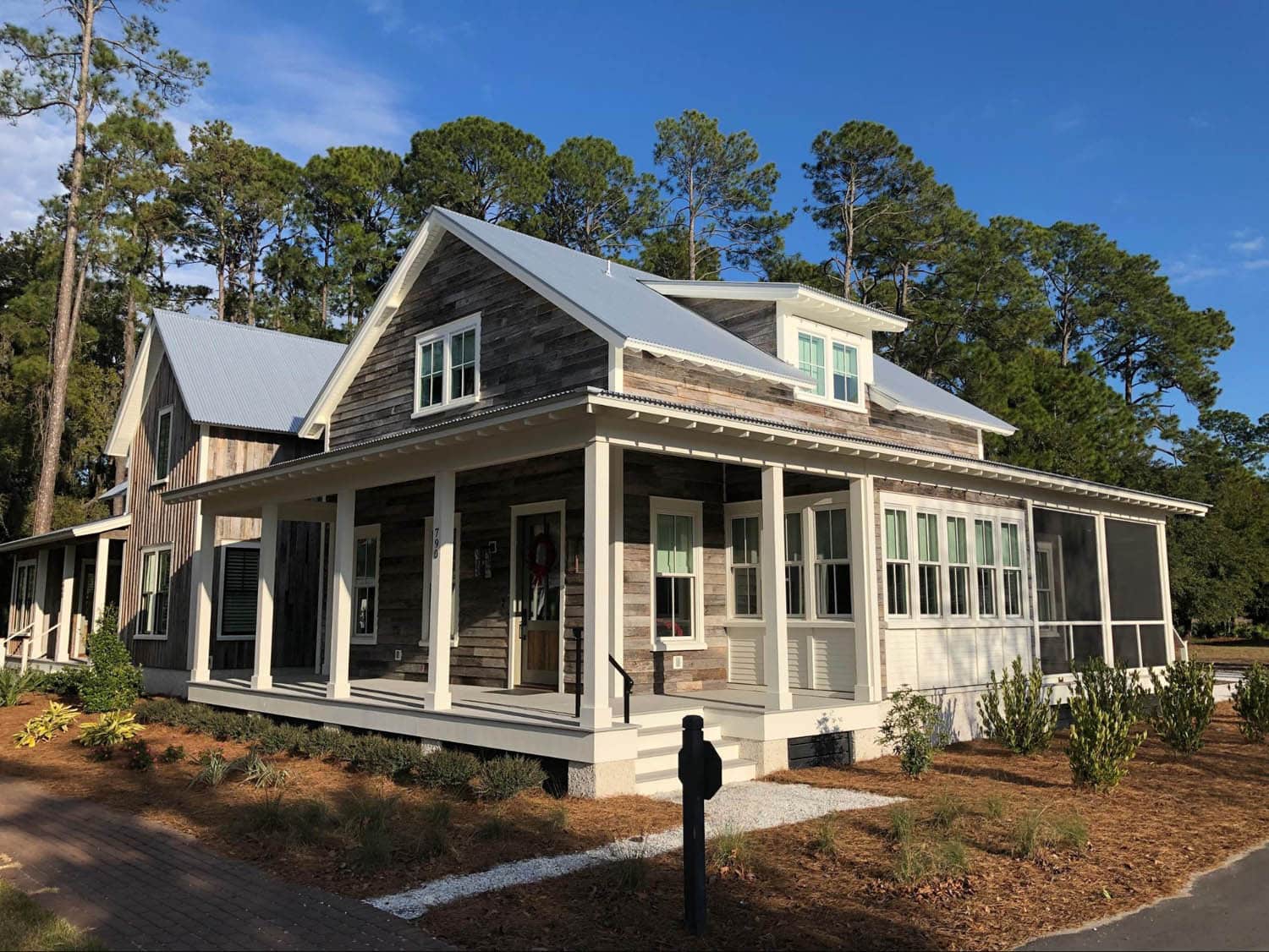 Wood house with large wraparound porch